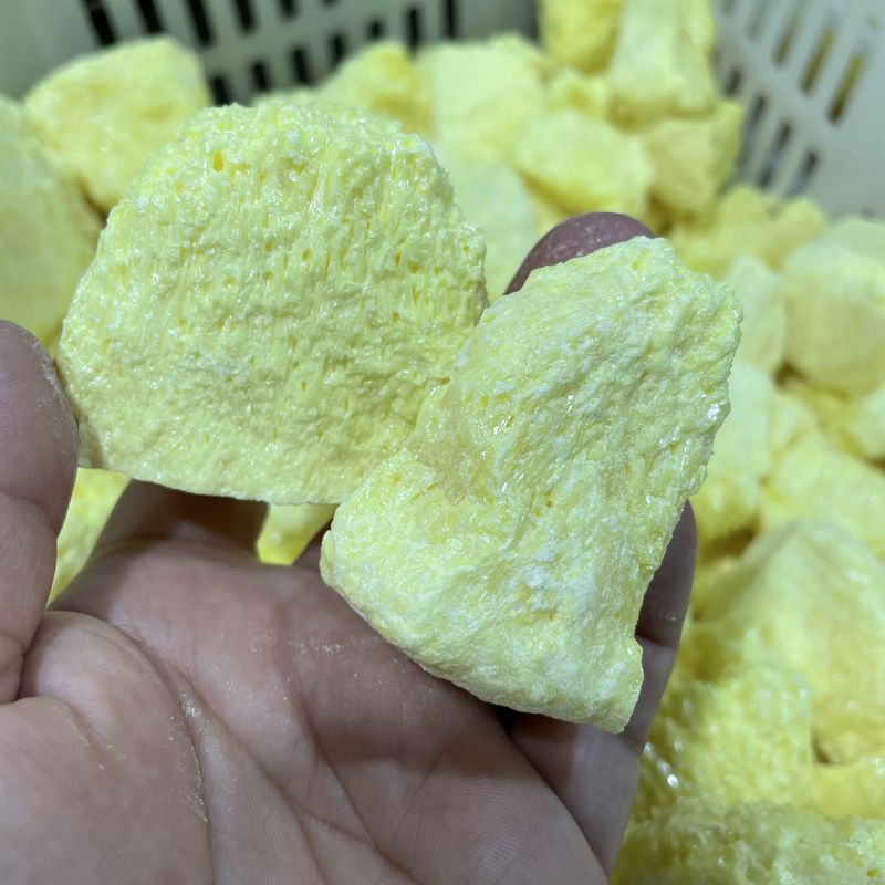Raw yellow lumps of elemental sulfur in bulk