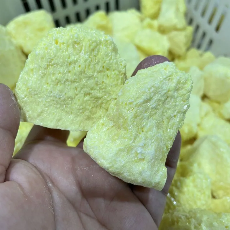 Raw yellow lumps of elemental sulfur in bulk